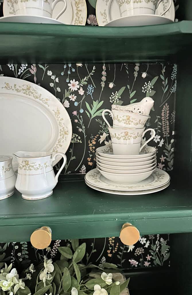 close up of china on old hutch
