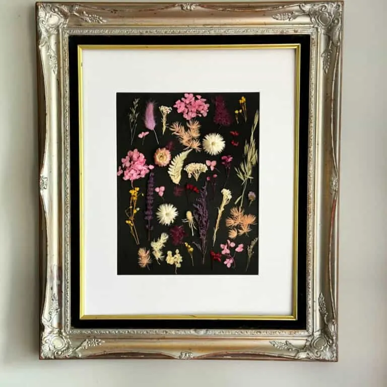 full view of dried flower wall art hanging.