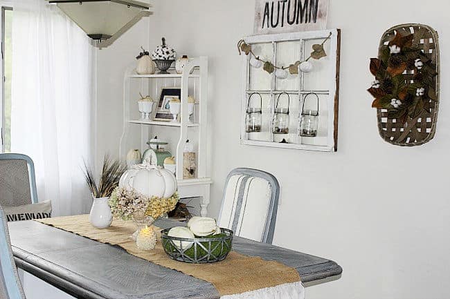 dining room table with white pumpkins