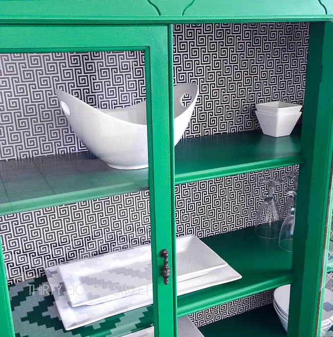 green painted cabinet with mod podge geometric pattern