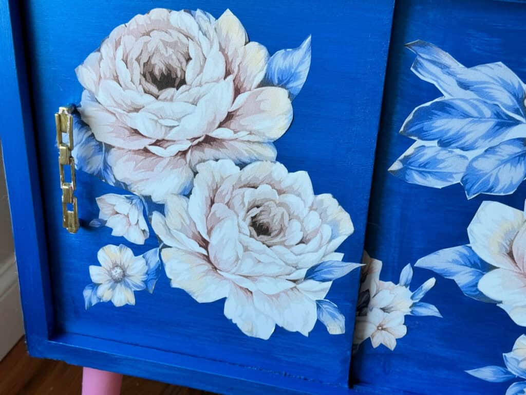 close up of flower wallpaper on cabinet