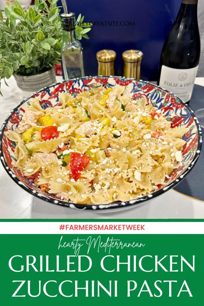 pasta in large serving bowl with wine and plant