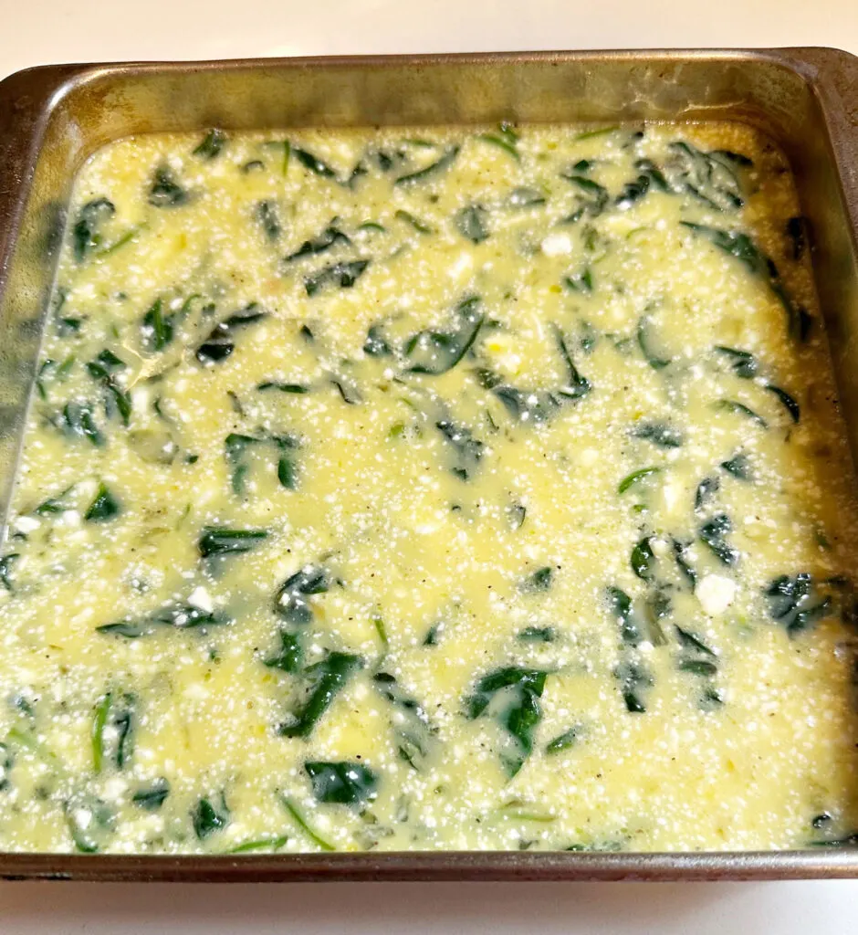 pouring frittata in 8x8 baking dish