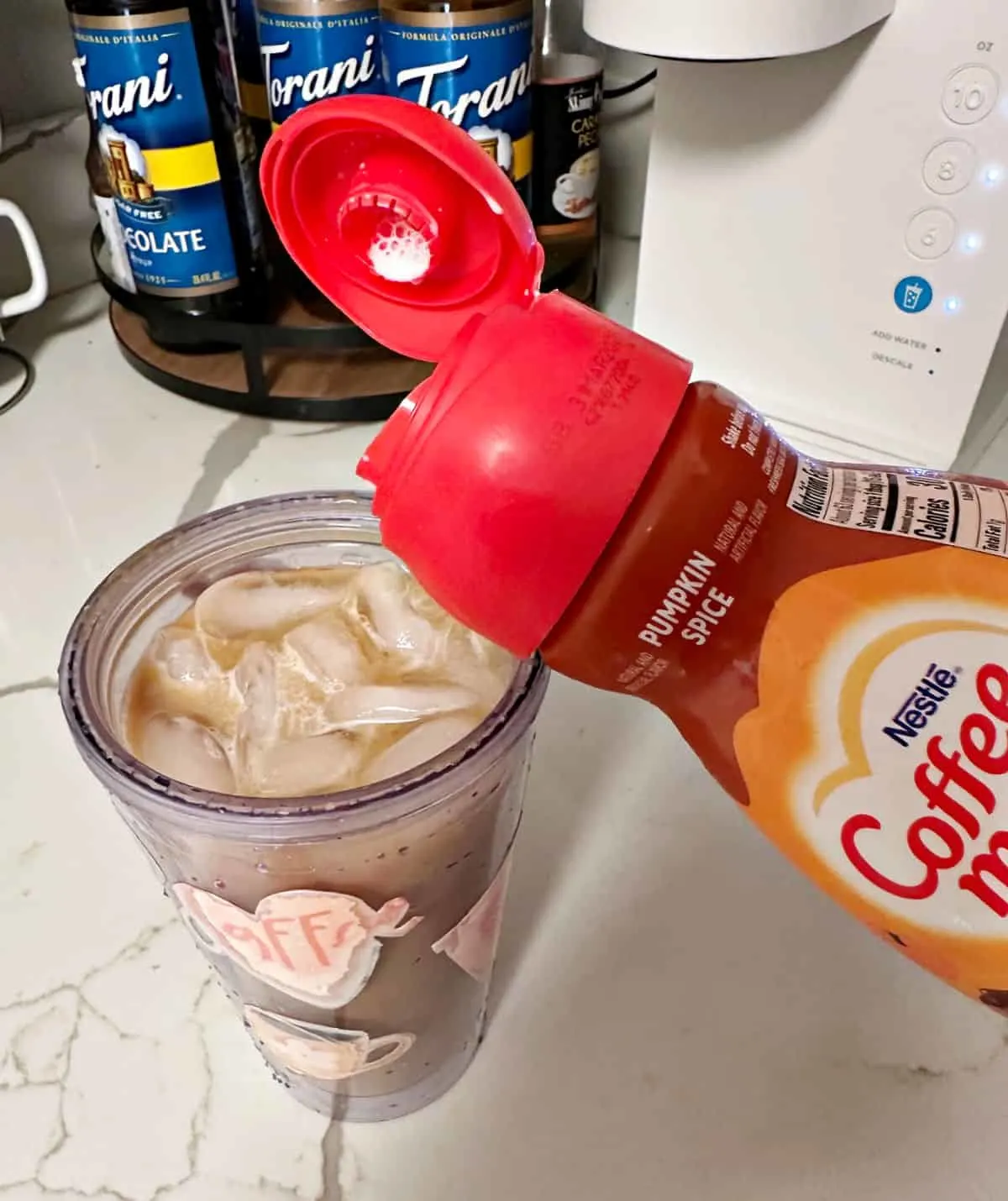 adding pumpkin spice creamer