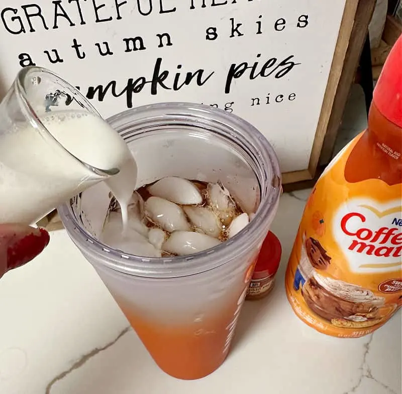 adding pumpkin spice creamer