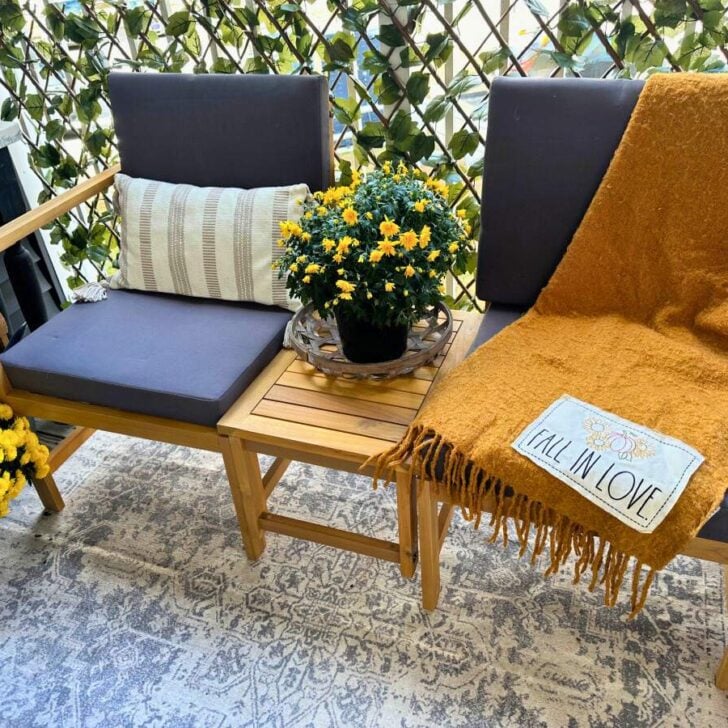 fall balcony with lowe's patio set and mums