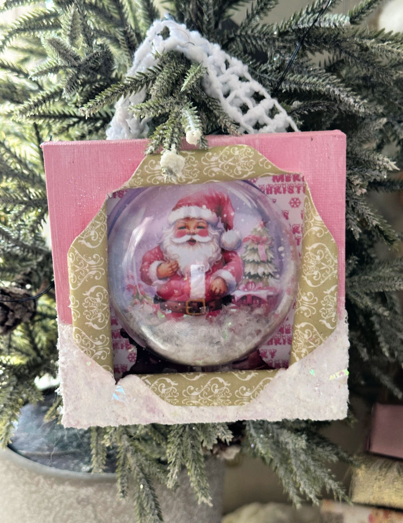 close up of busted canvas snow globe ornament