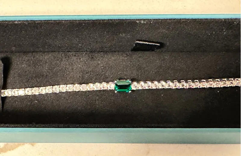 close up of tennis bracelet in velvet box