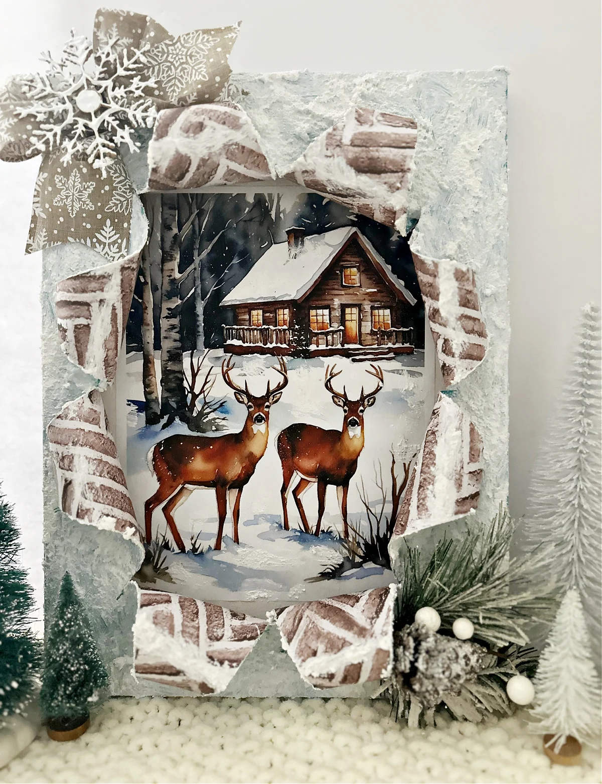 full view winter scene with deer and bottle brush trees