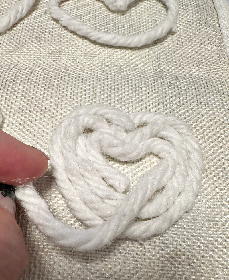 gluing hearts on pillow