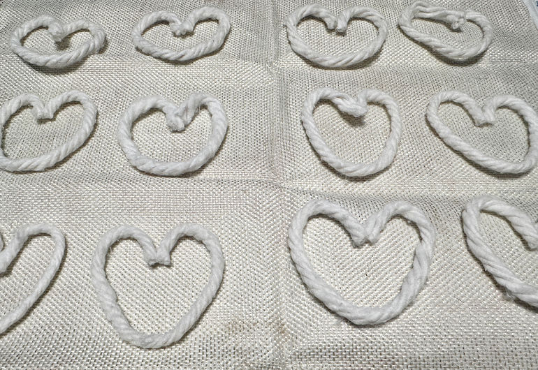 single yarn heart on pillow