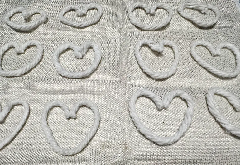 single yarn heart on pillow