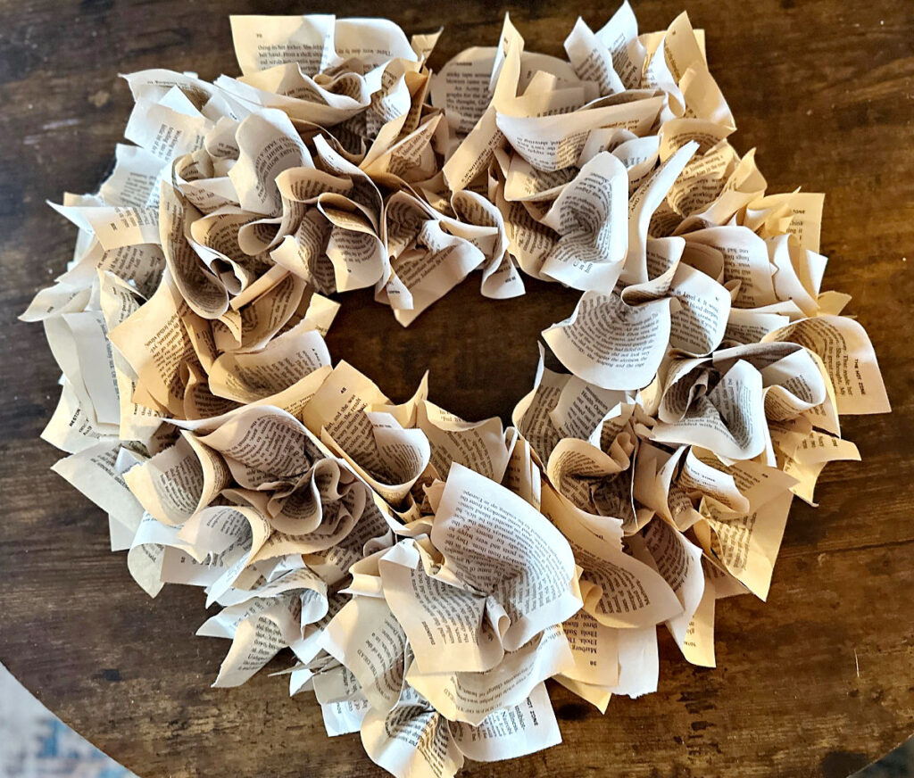 finished book page wreath on table