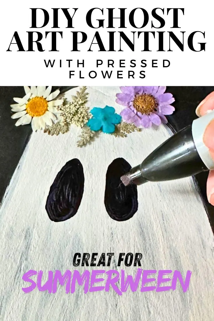 close up of ghost painting with flowers for summerween