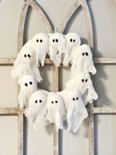 DIY Ghost Wreath Pottery Barn Dupe hanging on arch window