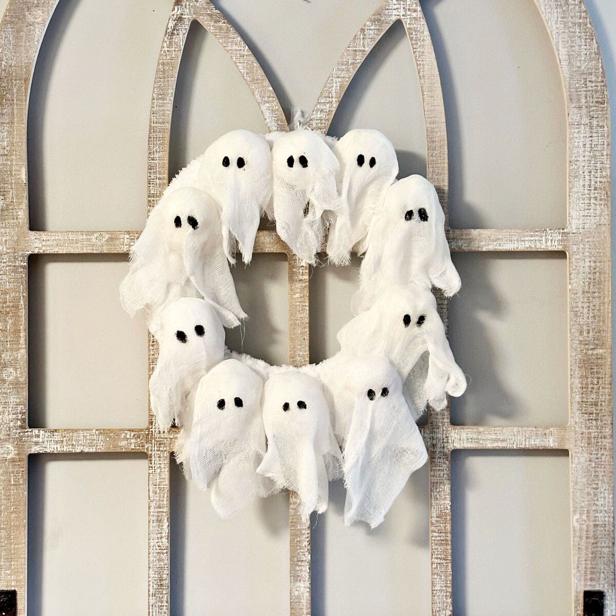 DIY Ghost Wreath Pottery Barn Dupe on arch window
