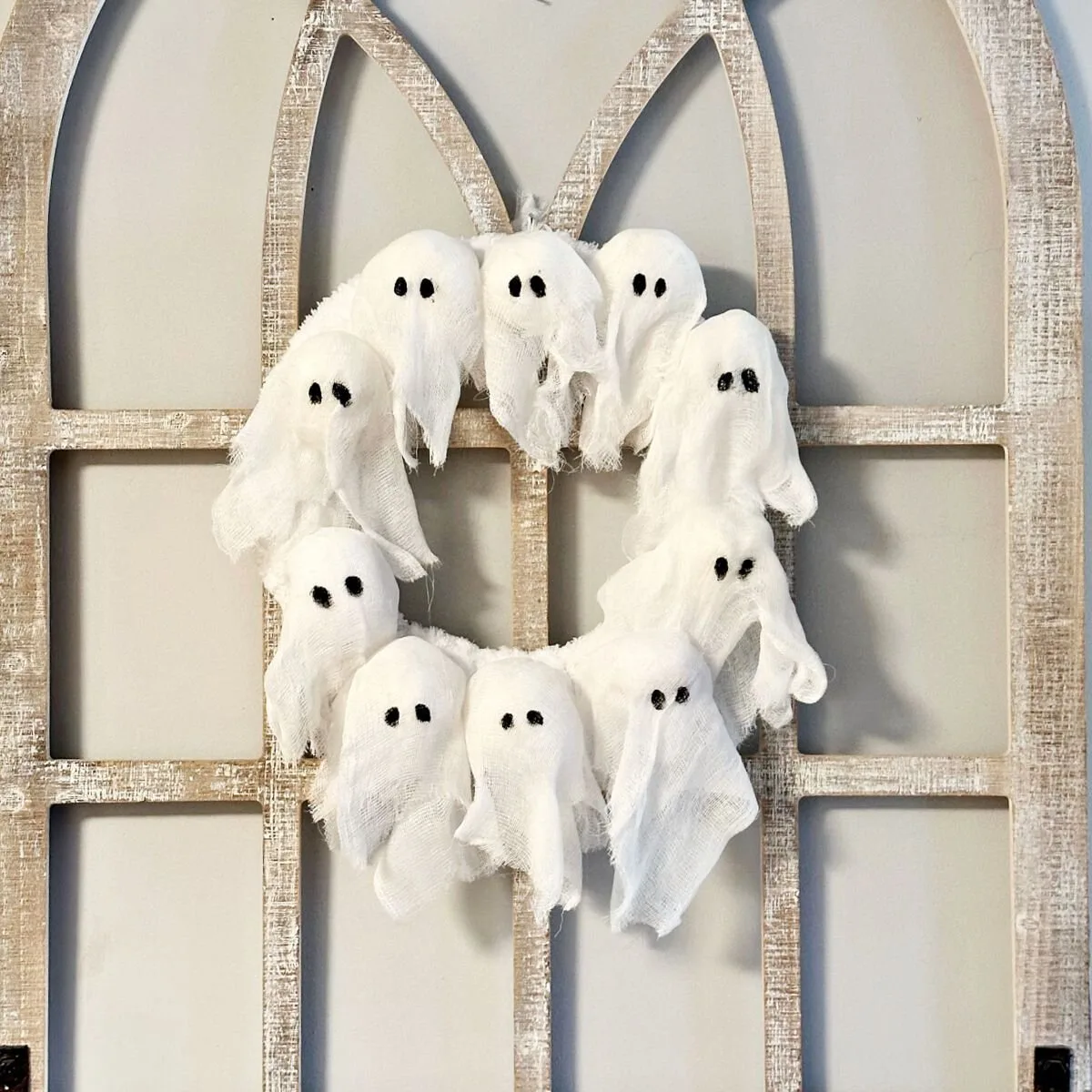 DIY Ghost Wreath Pottery Barn Dupe on arch window