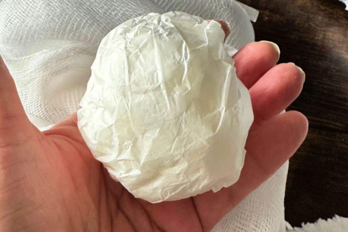 rolling up paper bag for diy ghosts