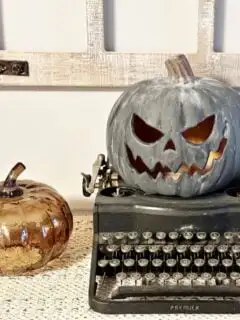 Pottery Barn Black Terracotta Pumpkin on typewriter
