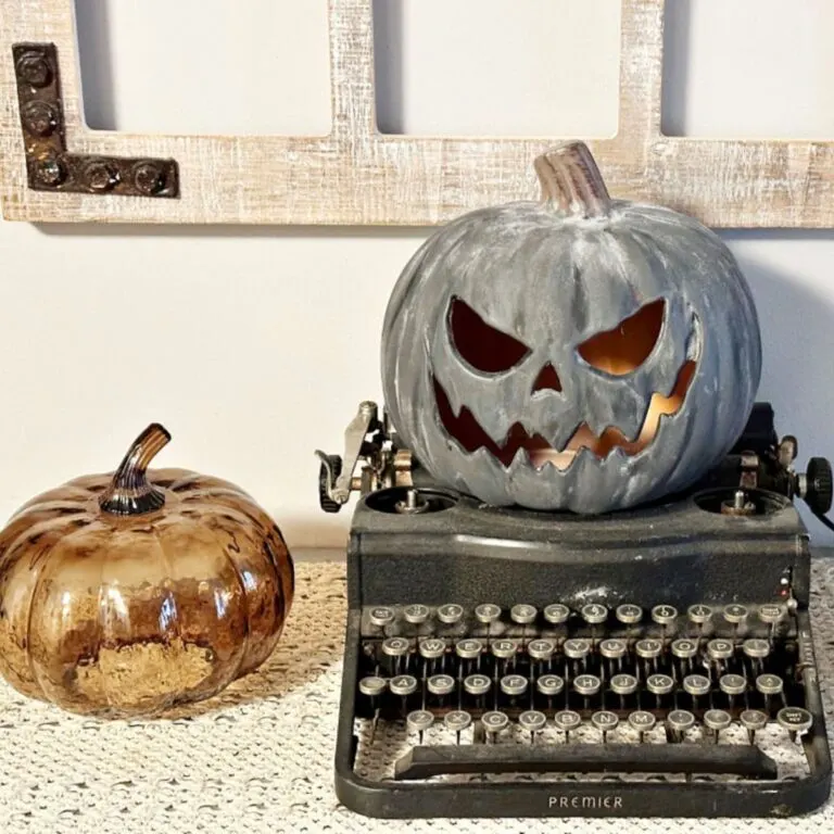 Pottery Barn Black Terracotta Pumpkin on typewriter