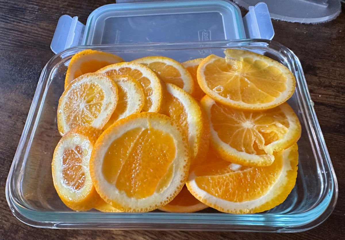 leftover sliced oranges in glass container