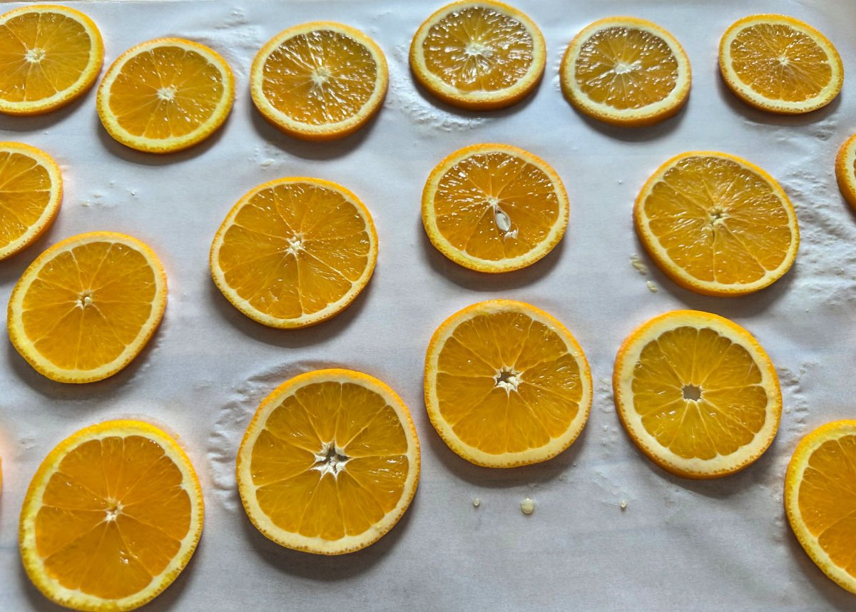 sliced oranges on parchment paper