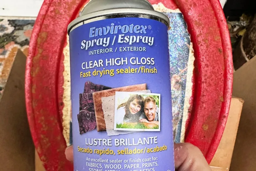 spraying sealer on tray