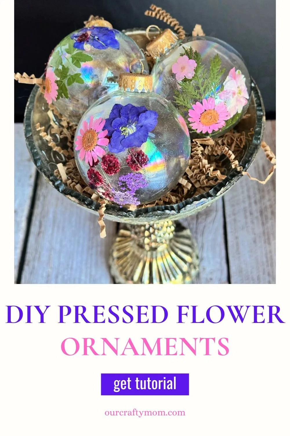 close up of pressed flower ornaments in silver bowl