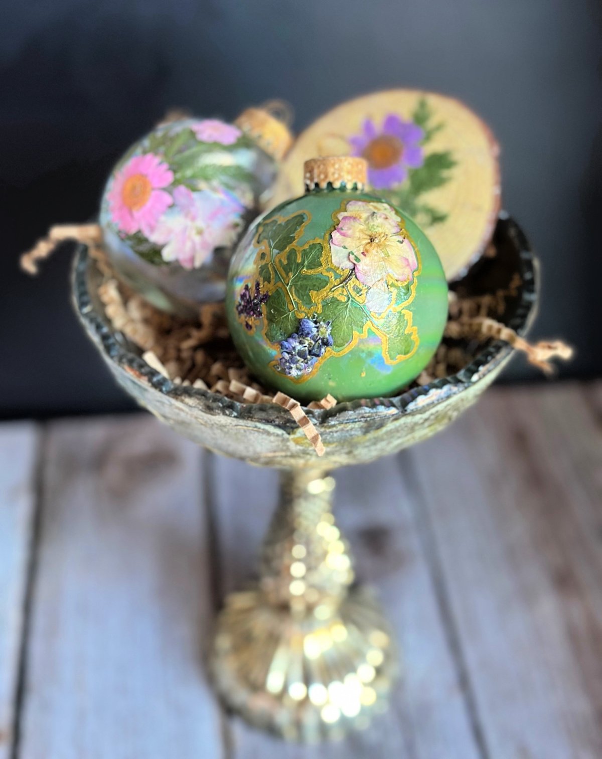 handmade Christmas ornament painted green with dried flowers