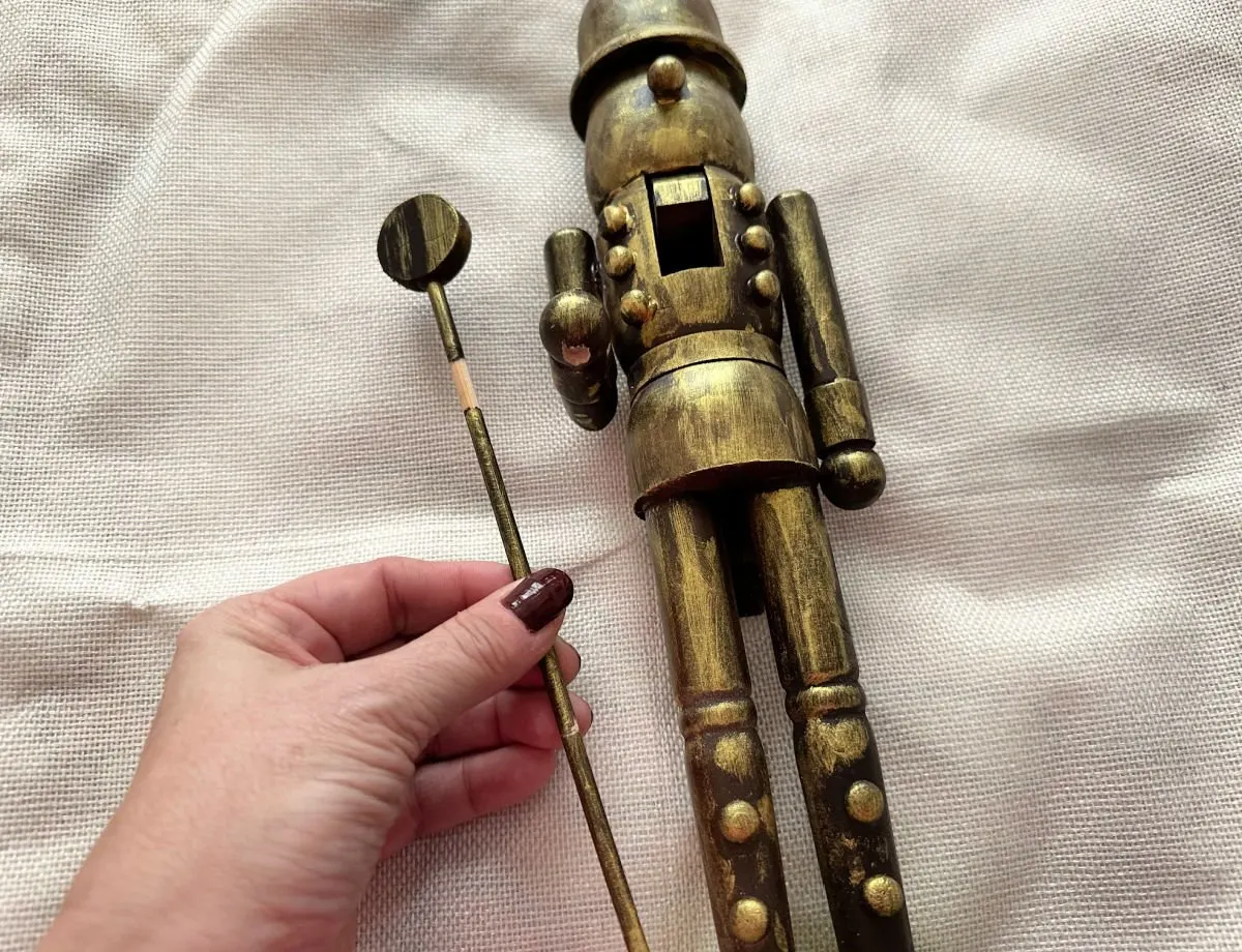 removing staff from painted nutcracker