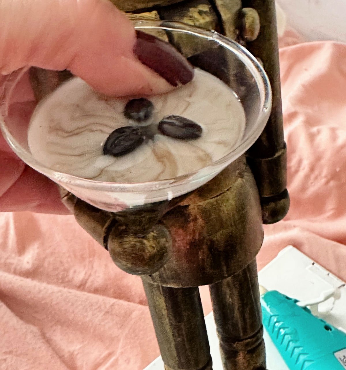 adding pressure to martini ornament to set glue