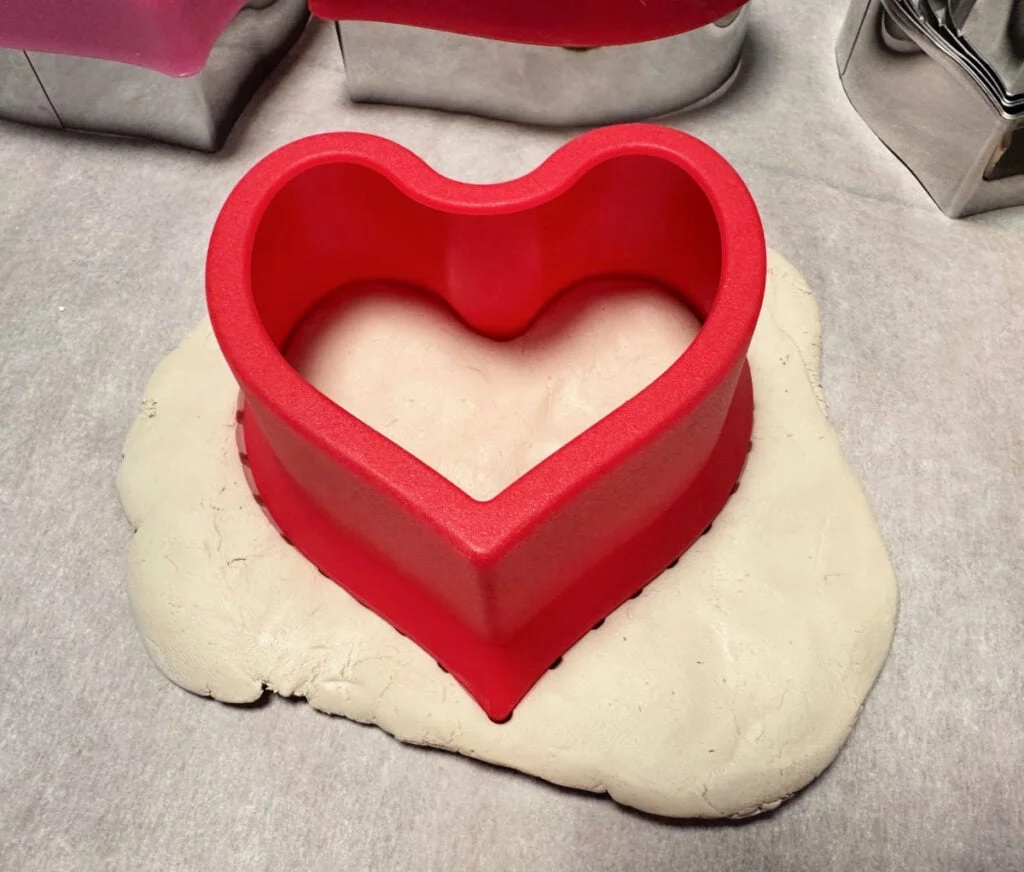 using cookie cutter on clay hearts