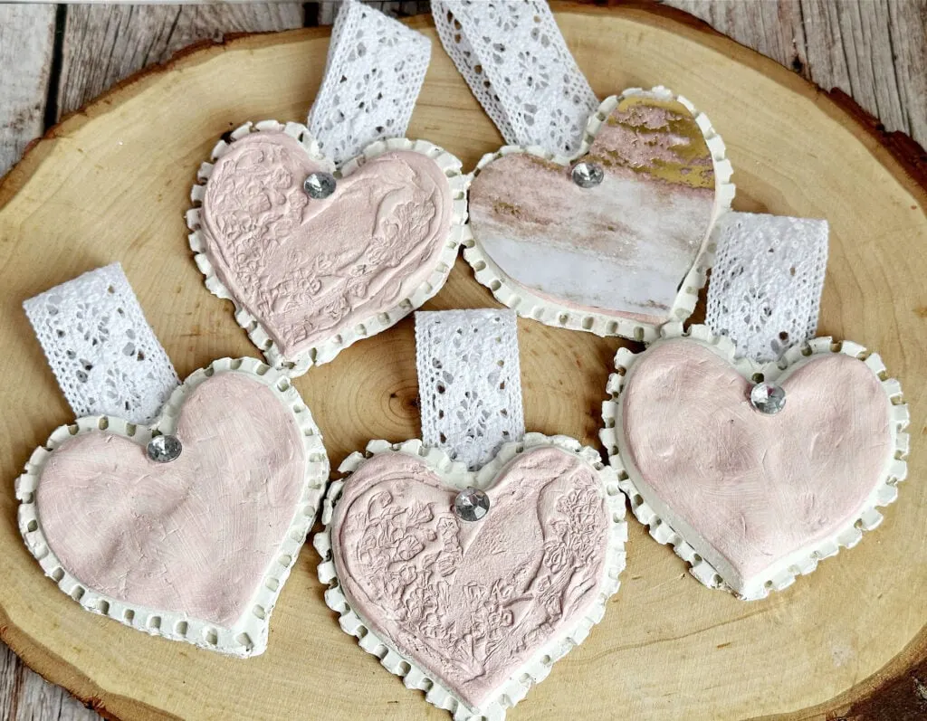 pink and white painted air dry clay hearts with lace ribbon