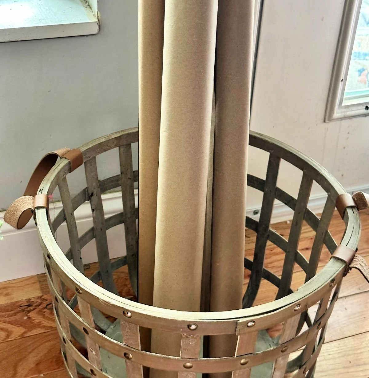 empty wrapping paper rolls in basket