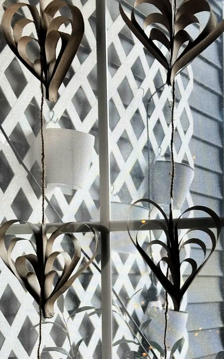 paper strip hearts hanging in window
