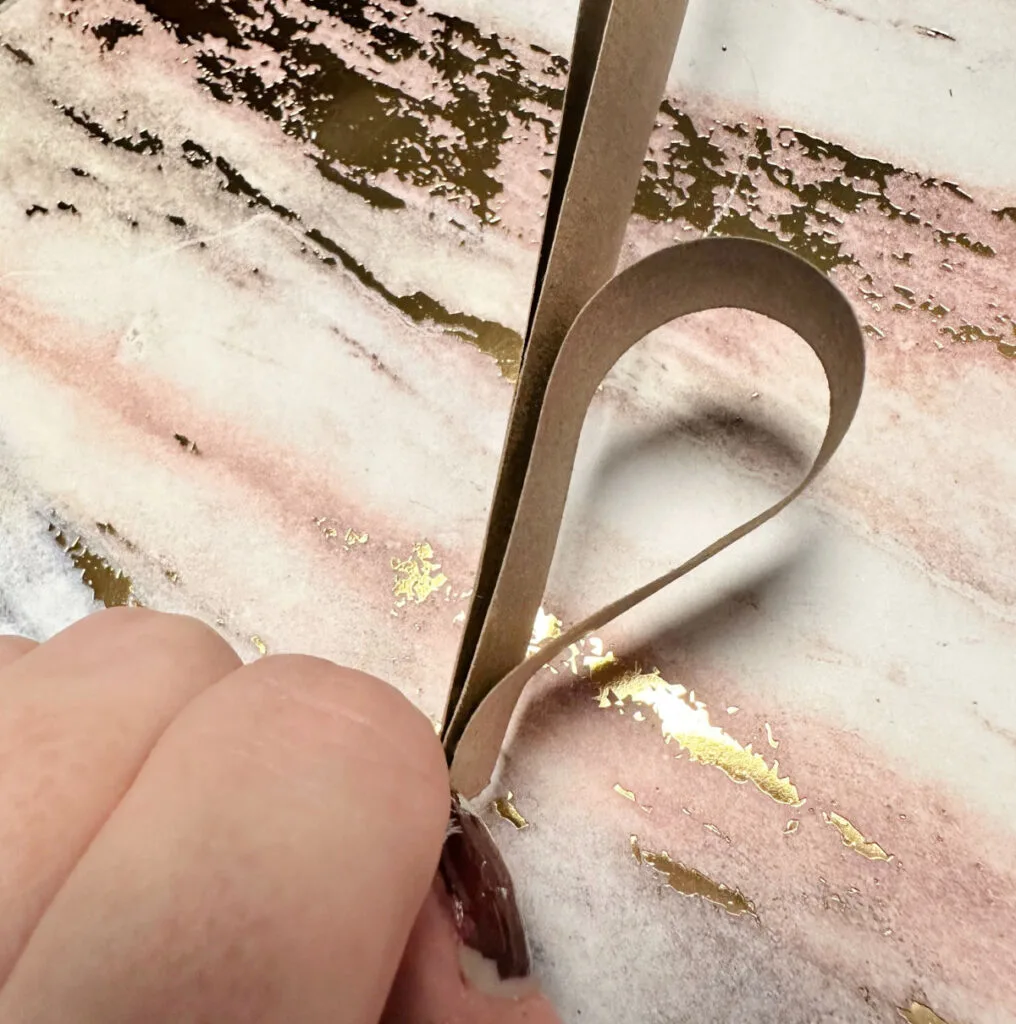 folding first paper strip for heart