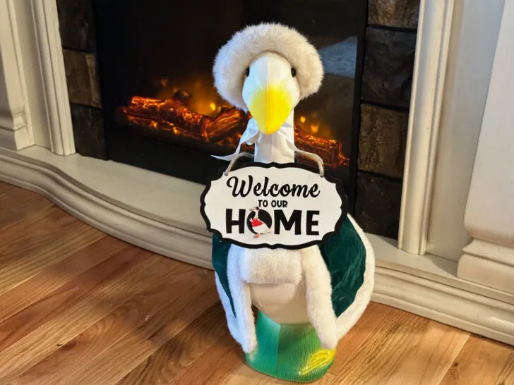 porch goose with sign