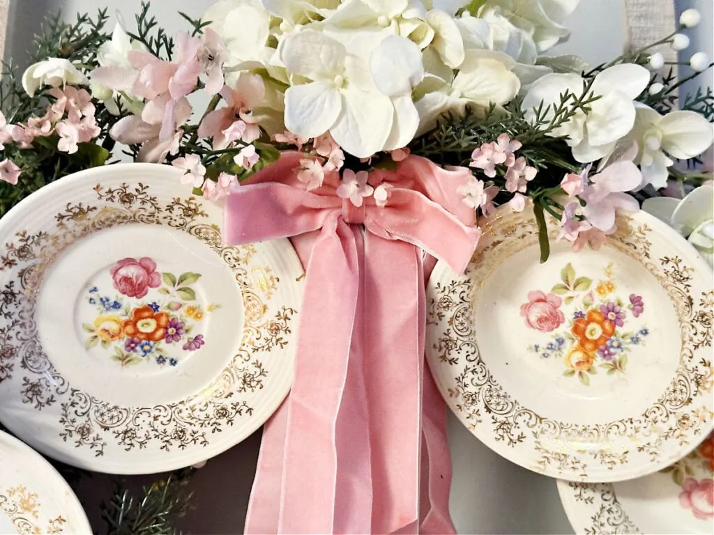 adding flowers to plate wreath