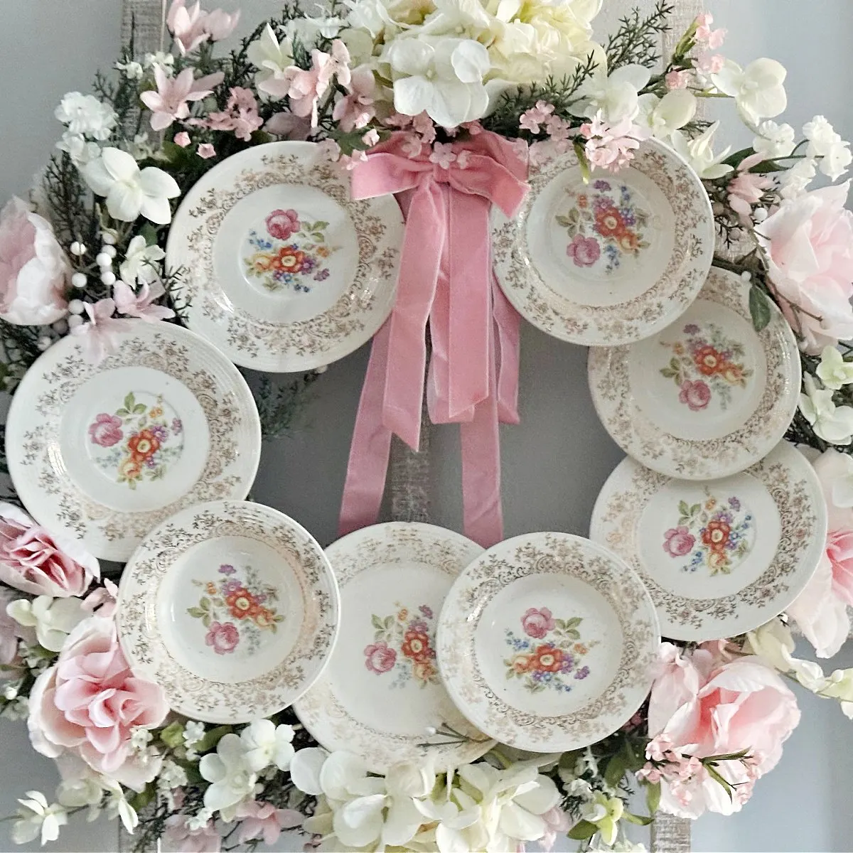 close up of diy plate wreath with pink velvet bow
