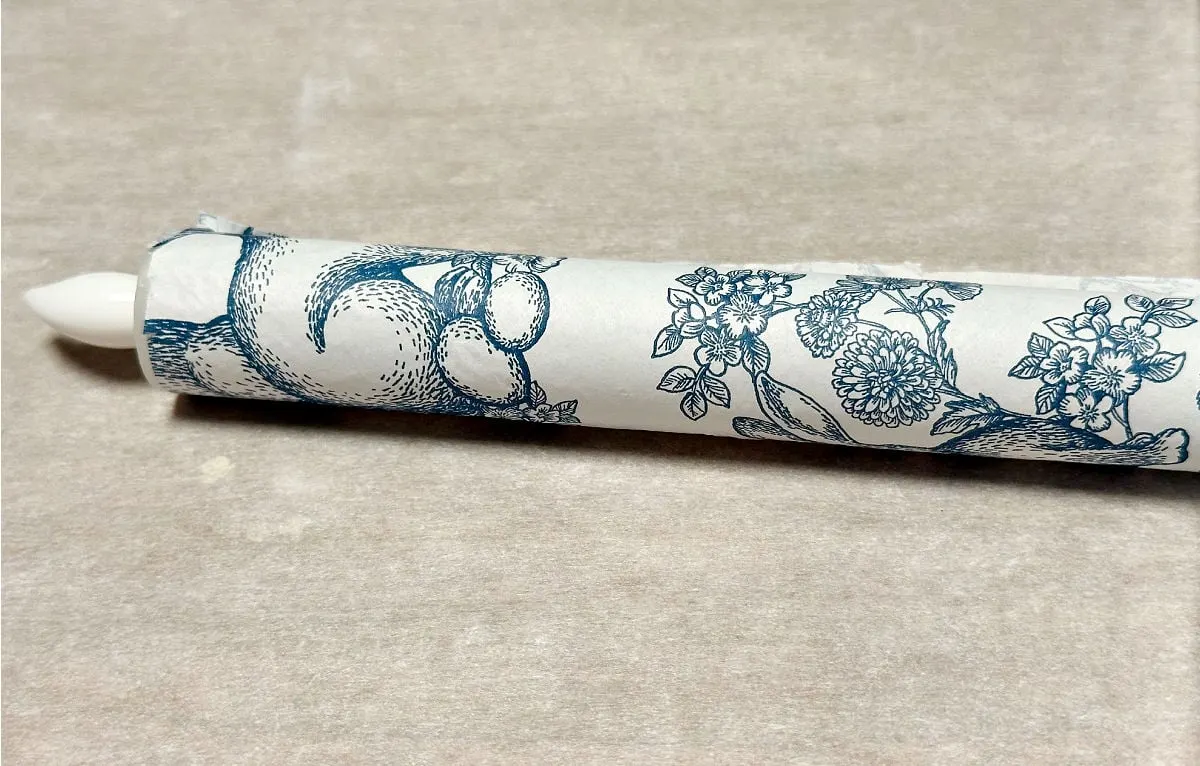 covering candle with napkin