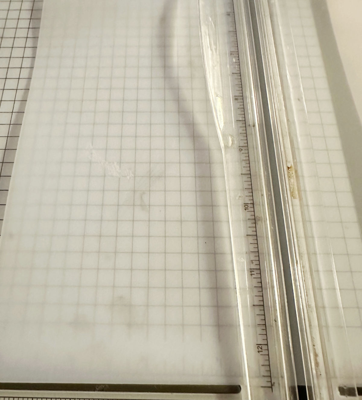 using paper cutter to cut dollar tree chopping mat