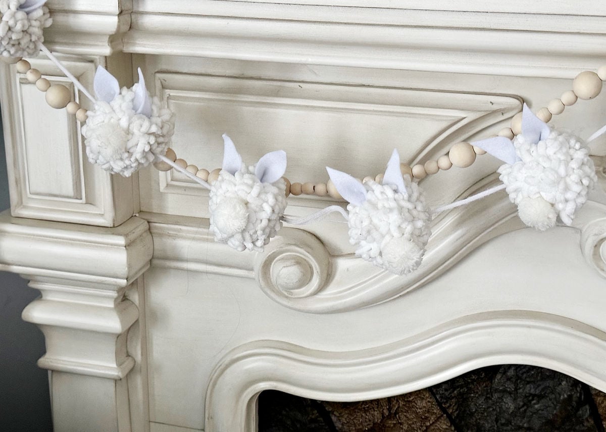 diy pom pom bunny garland on spring mantel