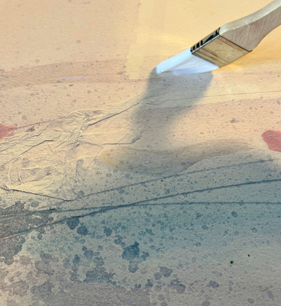 adding adhesive to wall art