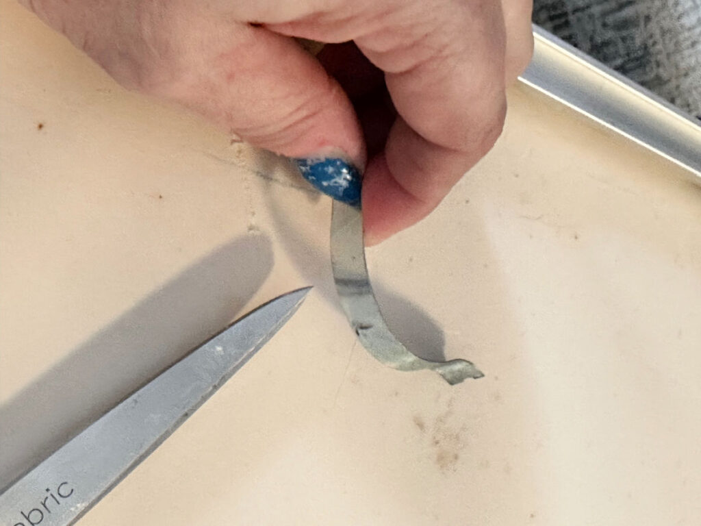 removing clips from thrift store art