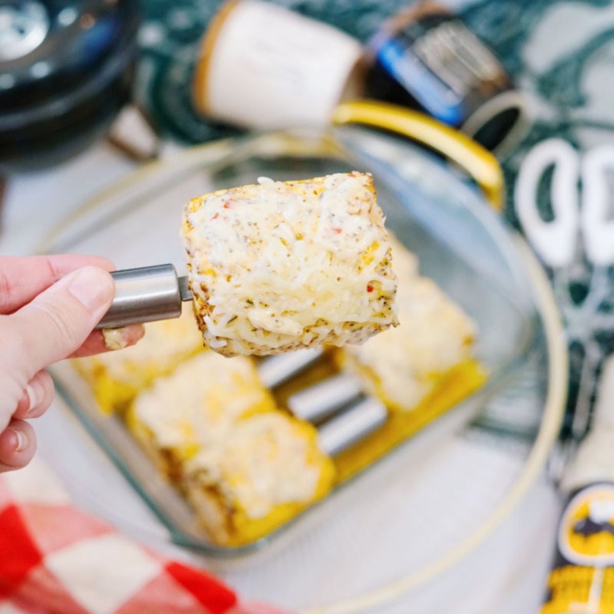 garlic parmesan corn on the cob in glass dish