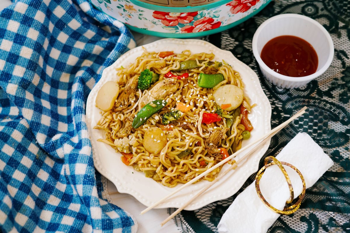 viral top ramen stir fry shown in white bowl
