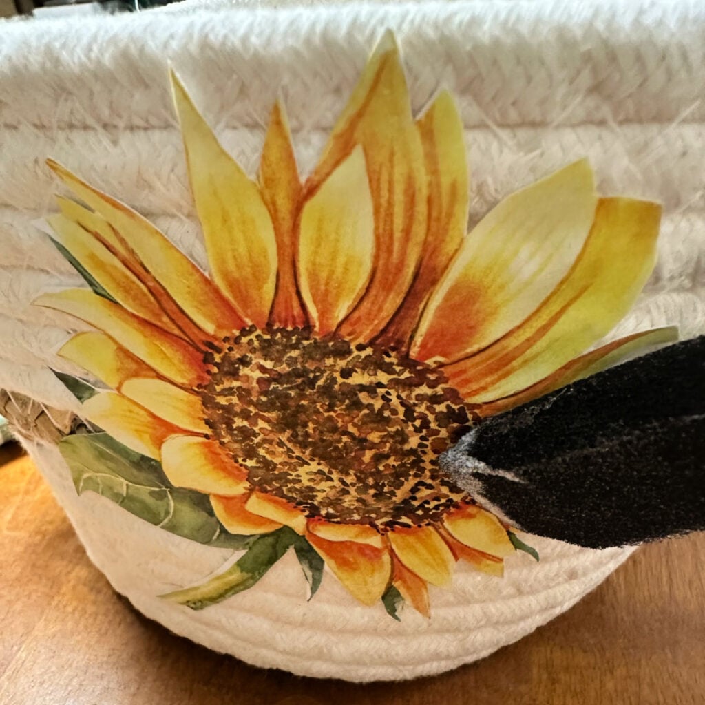 adding a top coat of mod podge to the image on the basket