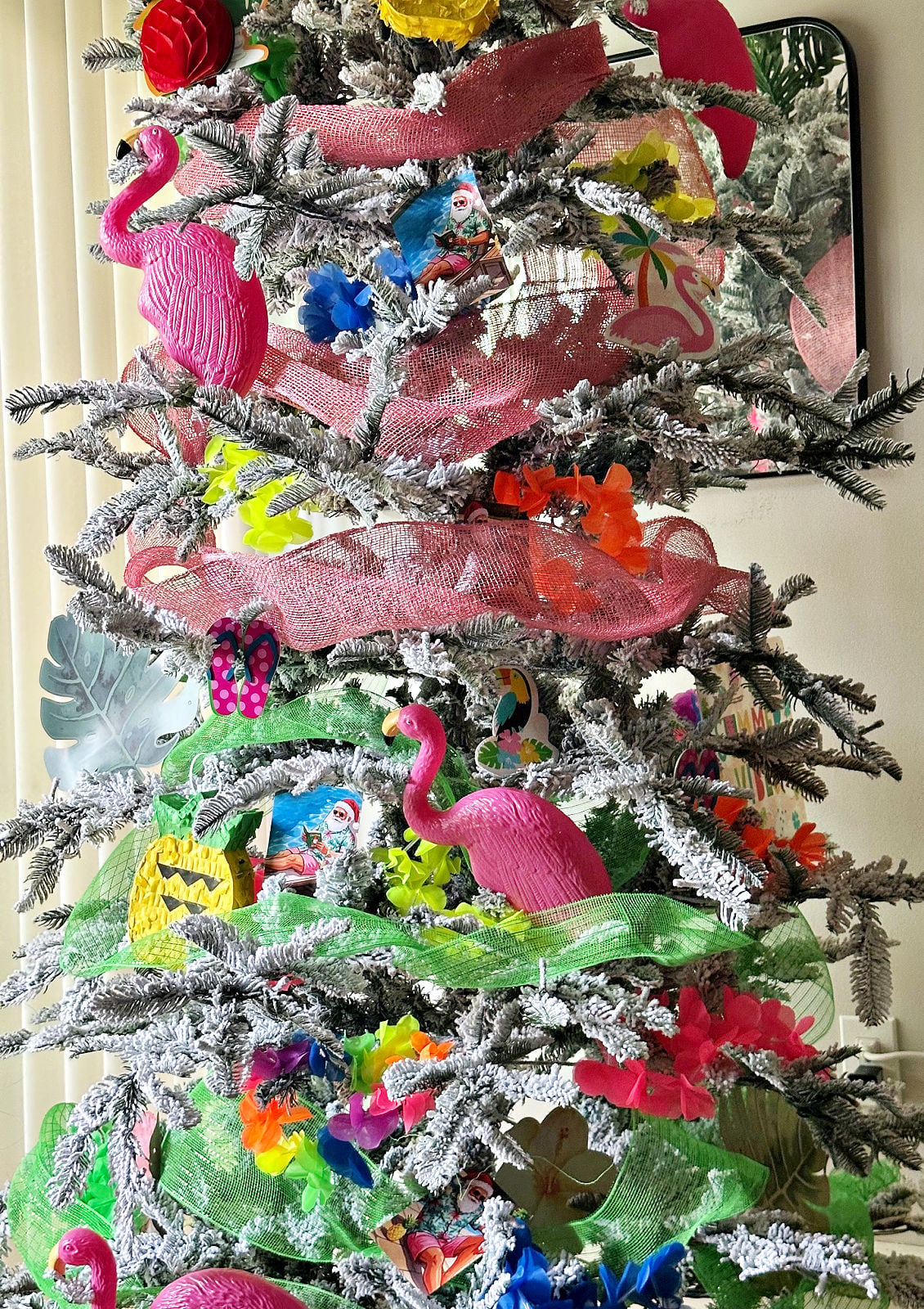 close up of summer christmas tree with pink flamingos