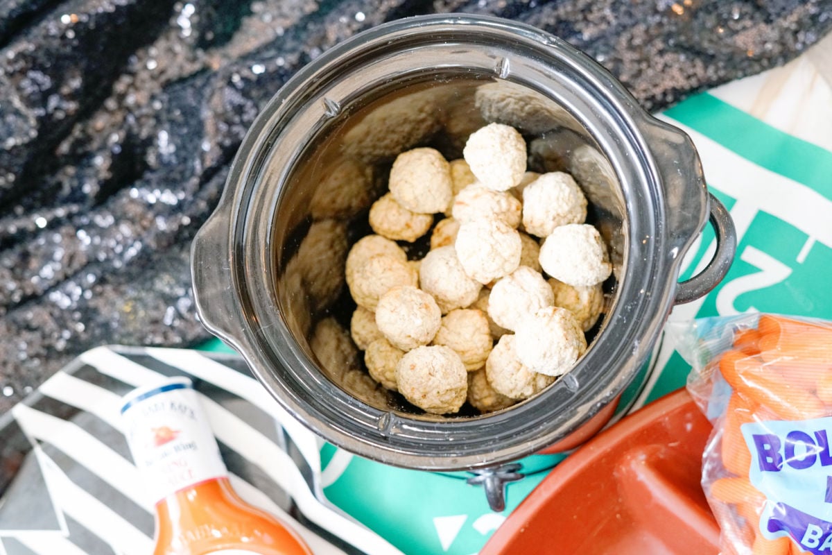 adding frozen meatballs to crock pot