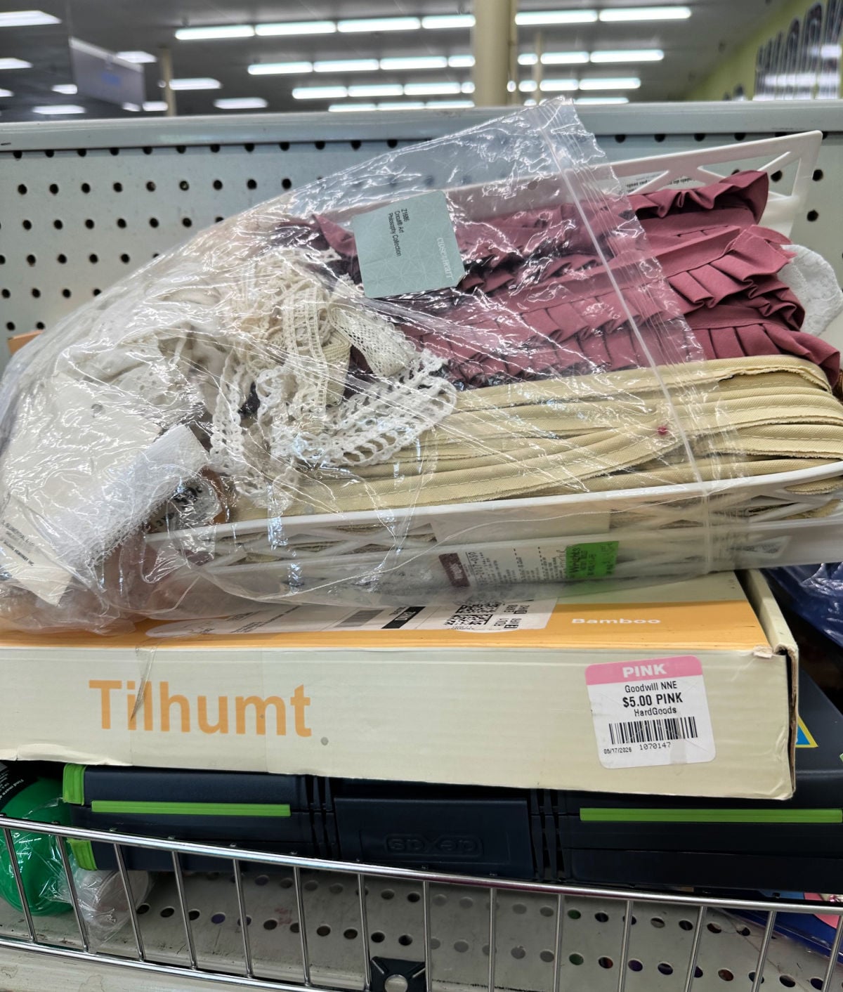 pack of ribbon and trimmings on rack at thrift store